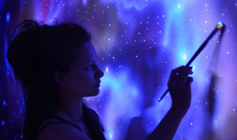 Glowing Murals Turn Dark Rooms Into Dreamy Worlds